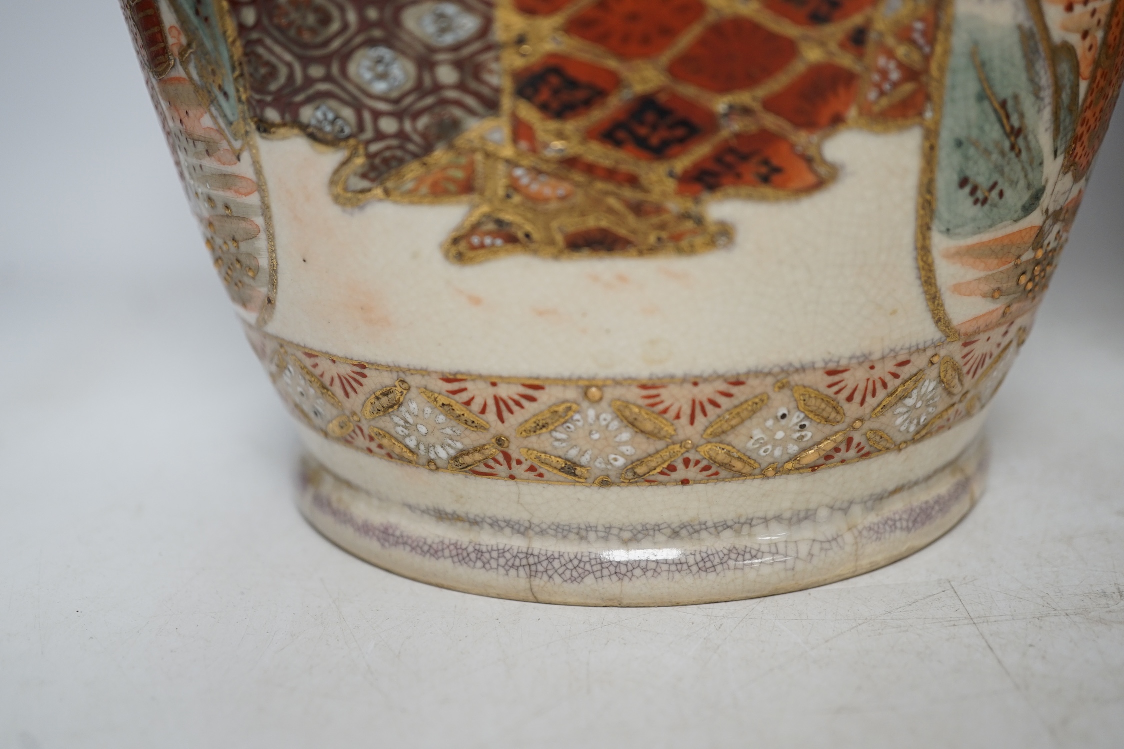 A pair of early 20th century Japanese Satsuma vases, 31cm high. Condition - poor, one repaired